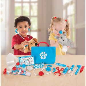 Children playing with vet set