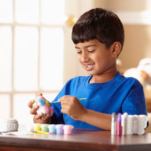 boy decorating resin flower box