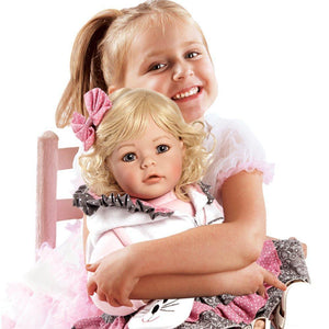 Toddler Time Doll The Cat's Meow Little girl holding doll
