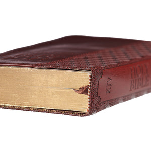 up close of gilt-edged pages and satin ribbon bookmark
