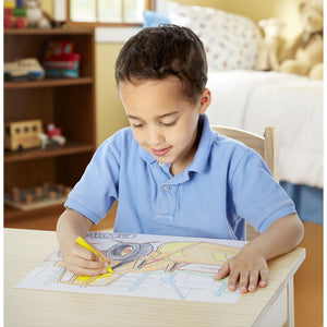Boy using coloring pad