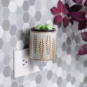 Fragrance Warmer Plugged into Horizontal Outlet