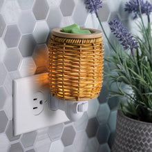 Fragrance Warmer Plugged into Horizontal Outlet