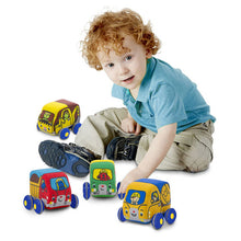 Child playing with pull back cars