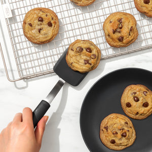 Moving cookies with spatula.
