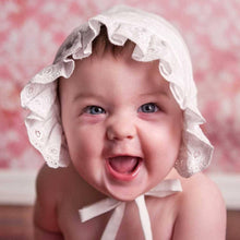 Baby wearing baby bonnet