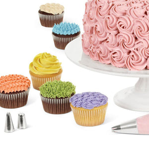 Frosted cake and cupcakes
