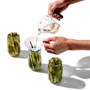 Using funnel to fill pickle jars