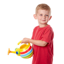 Boy holding watering can