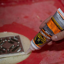 Gorilla Max Strength Construction Adhesive in use to glue drain