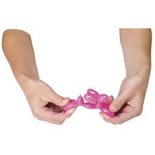 Hands stretching balloon dog toy