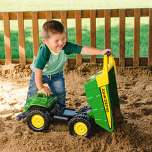 Child playing with dump truck