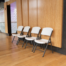 Folding chairs along the wall