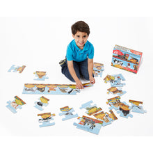 Boy putting puzzle together