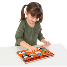 Girl putting puzzle together