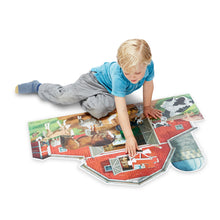 Child putting floor puzzle together.