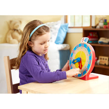 Girl playing with clock