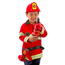 Child wearing fireman costume