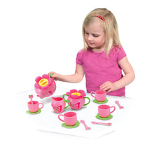 Girl playing with tea set