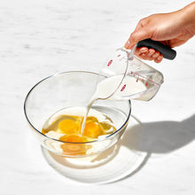 Using liquid measuring cup