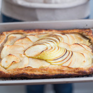 Apple tart in baking sheet.