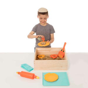 Boy playing with sand toys