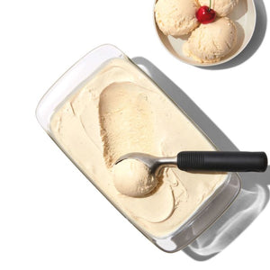 Scooping ice cream out of a dish
