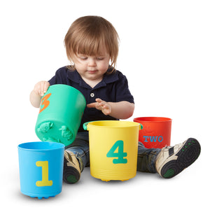 Child playing with sand buckets