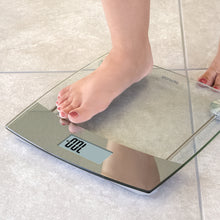 Foot stepping on scales