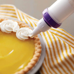 Adding whipped cream to a lemon pie